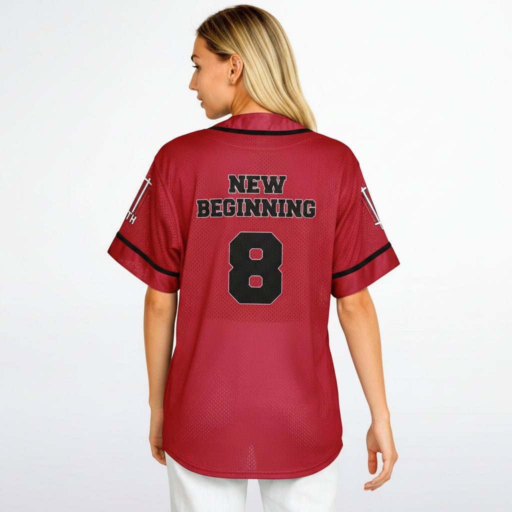 Person wearing a red sports jersey with 'New Beginning' and number '8' on a white background