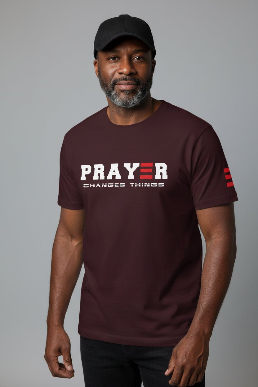 oxblood black t-shirt with 'PRAYER CHANGES THINGS' text on a grey background